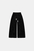 OCTAGON Folio black pleated velvet trousers with twin chrome bar ties, front flat lay