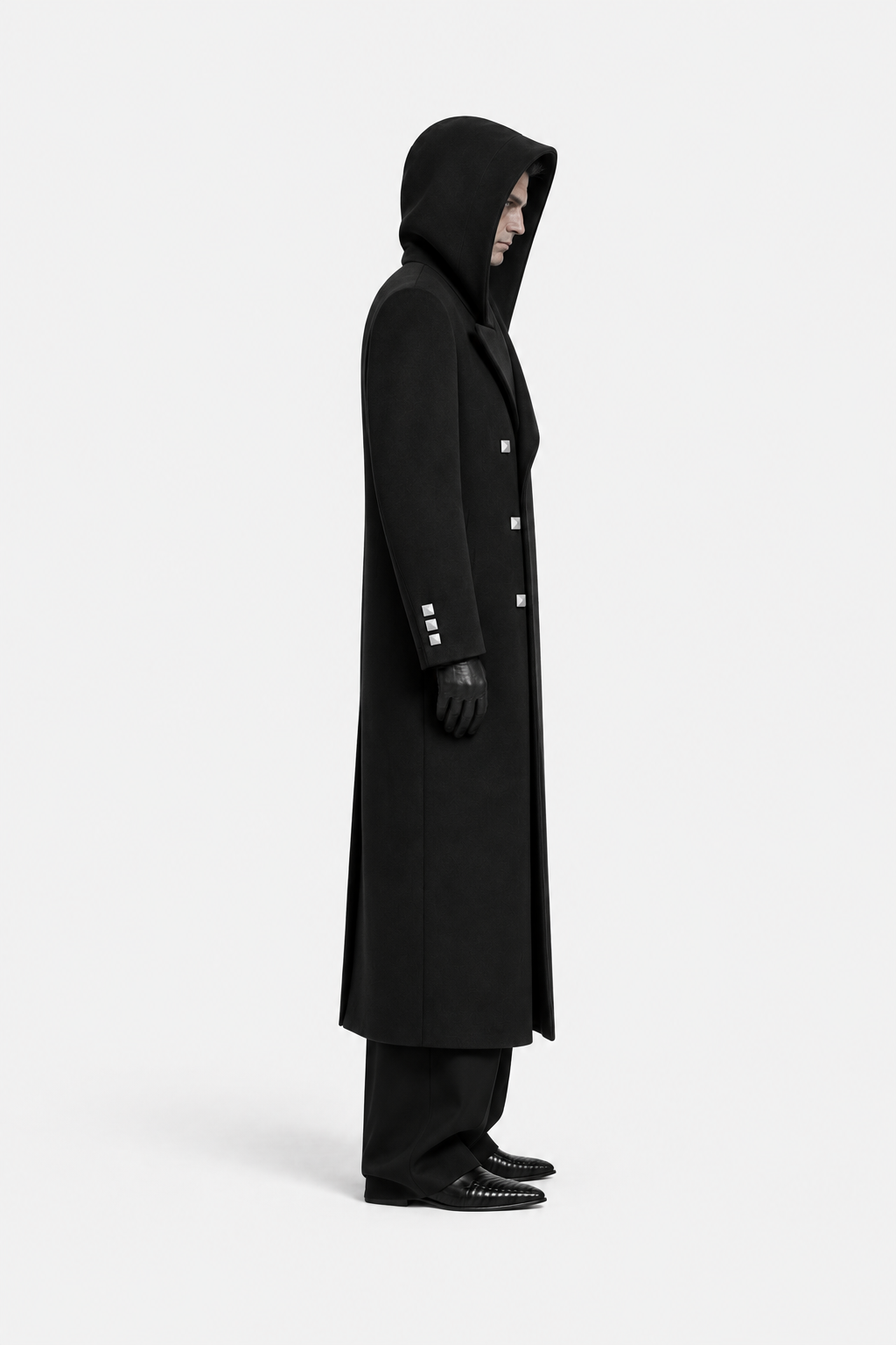 Black hooded square-button coat on a model, side profile