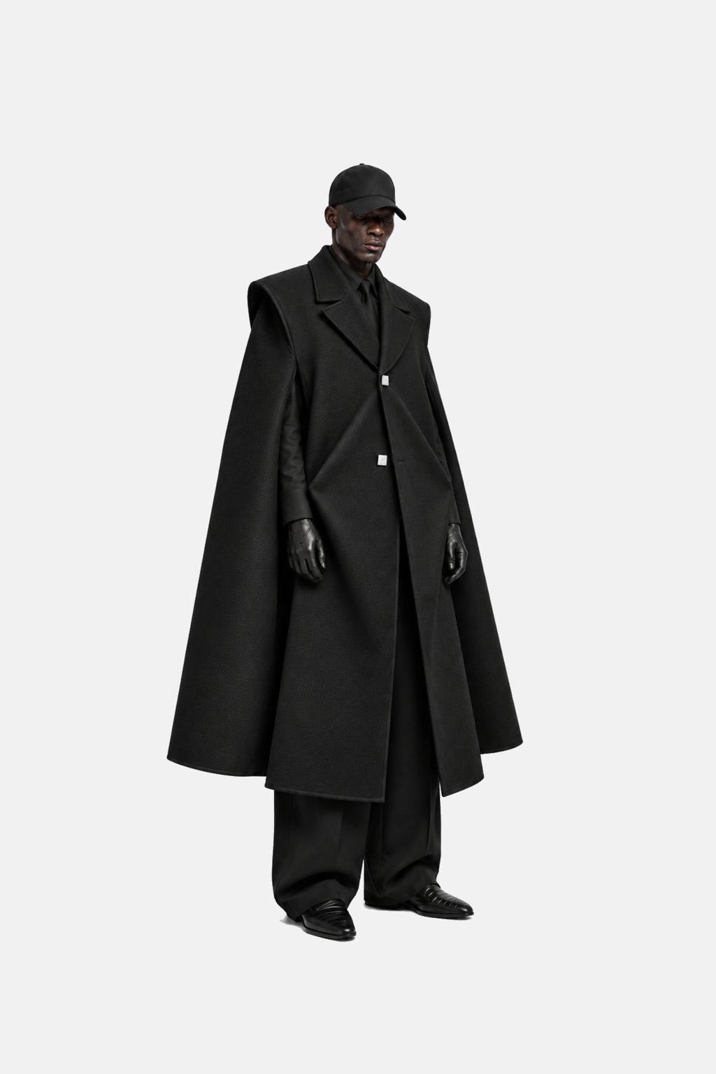 Three-quarter model view showing the coat sharp shoulder and hanging side panels