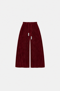 OCTAGON Folio oxblood pleated velvet trousers with twin chrome bar ties, front flat lay
