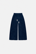 OCTAGON Folio midnight-blue pleated velvet trousers with twin chrome bar ties, front flat lay