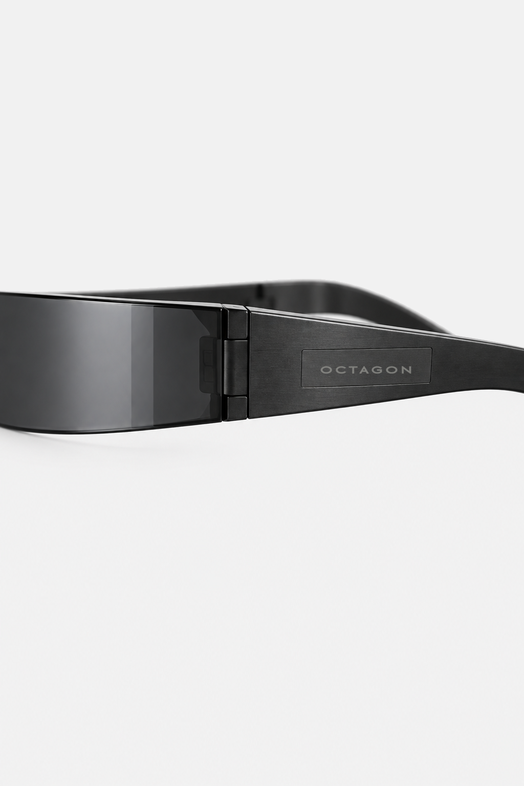 OCTAGON Blade Shield sunglasses, temple wordmark and concealed hinge detail