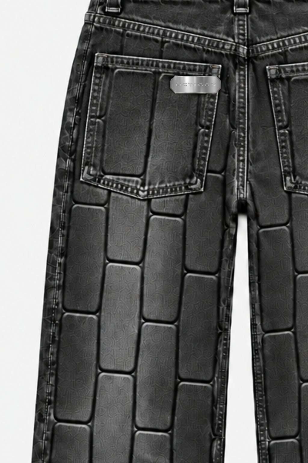 OCTAGON canonical metal tag on the rear pocket of washed-black Pentagon debossed jeans