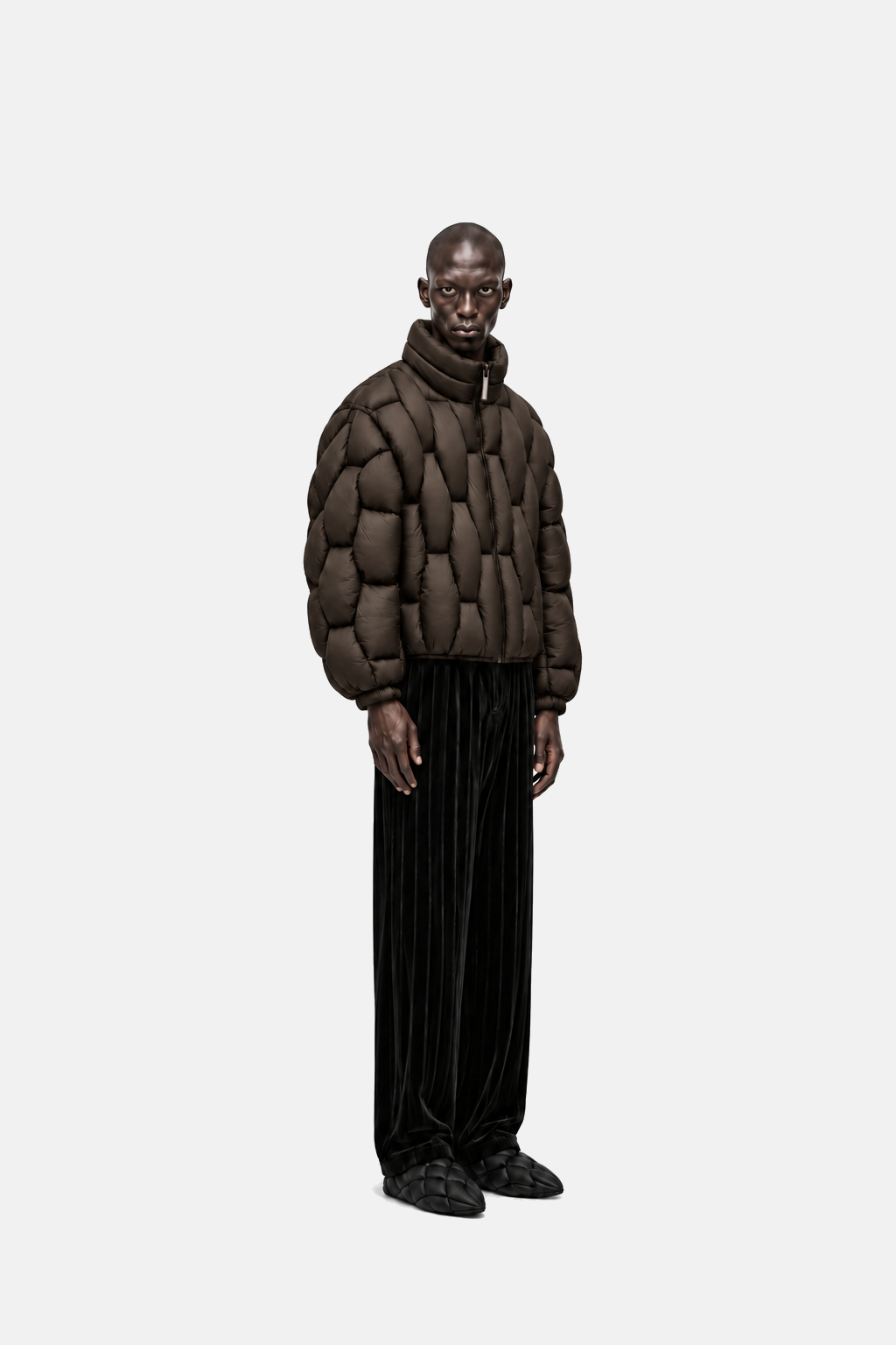 Male model wearing the espresso brown OCTAGON Pentagon matte puffer, three-quarter view