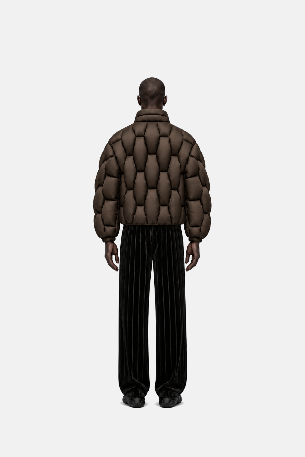 Male model wearing the espresso brown OCTAGON Pentagon matte puffer, rear view