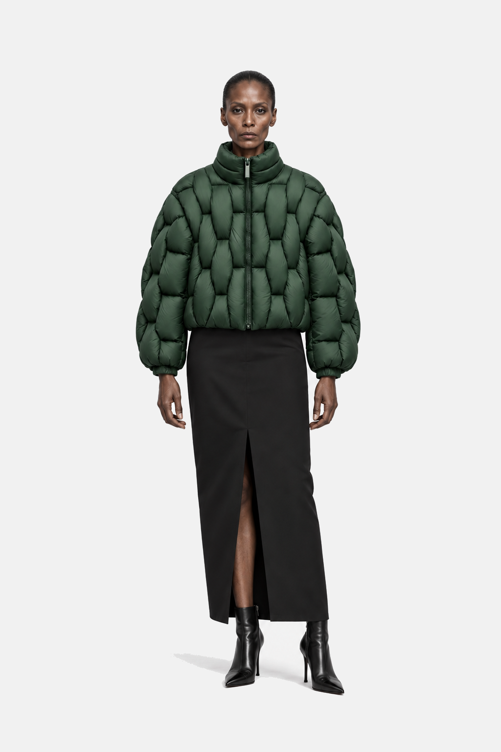 Mature woman wearing the forest green OCTAGON Pentagon matte puffer, front view