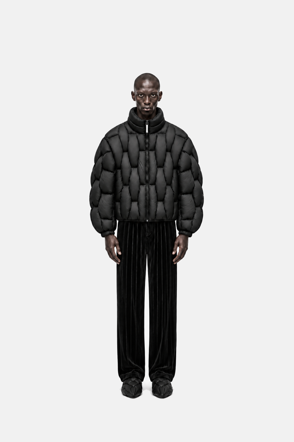 Male model wearing the black OCTAGON Pentagon matte puffer, straight front fit view