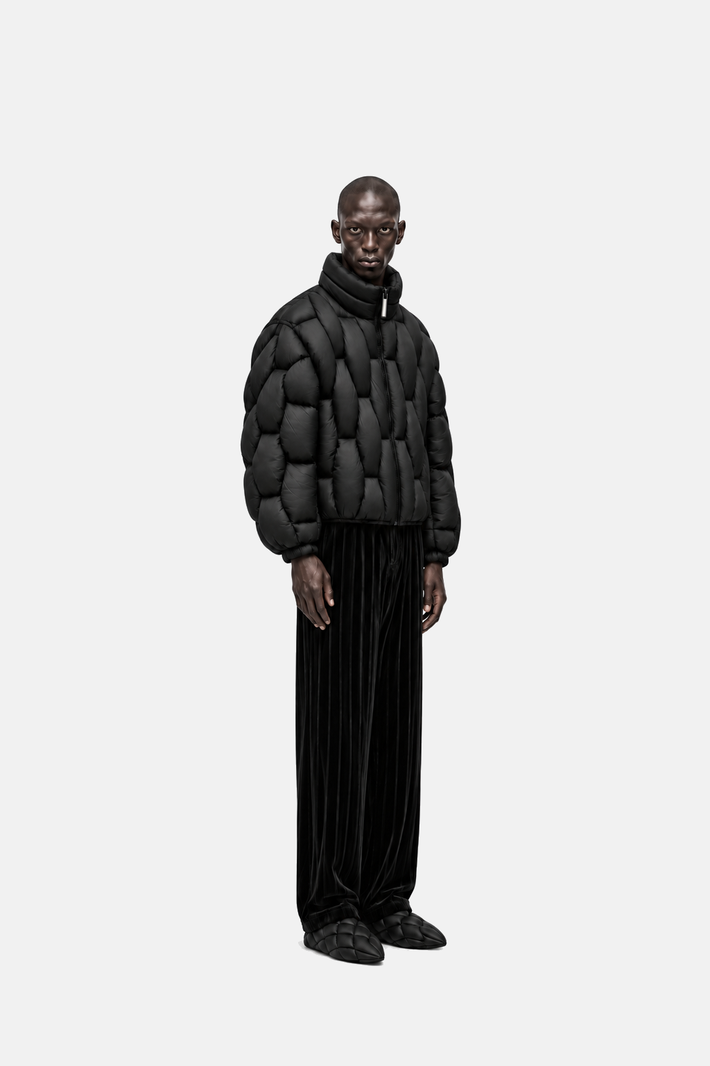 Male model wearing the black OCTAGON Pentagon matte puffer, three-quarter view