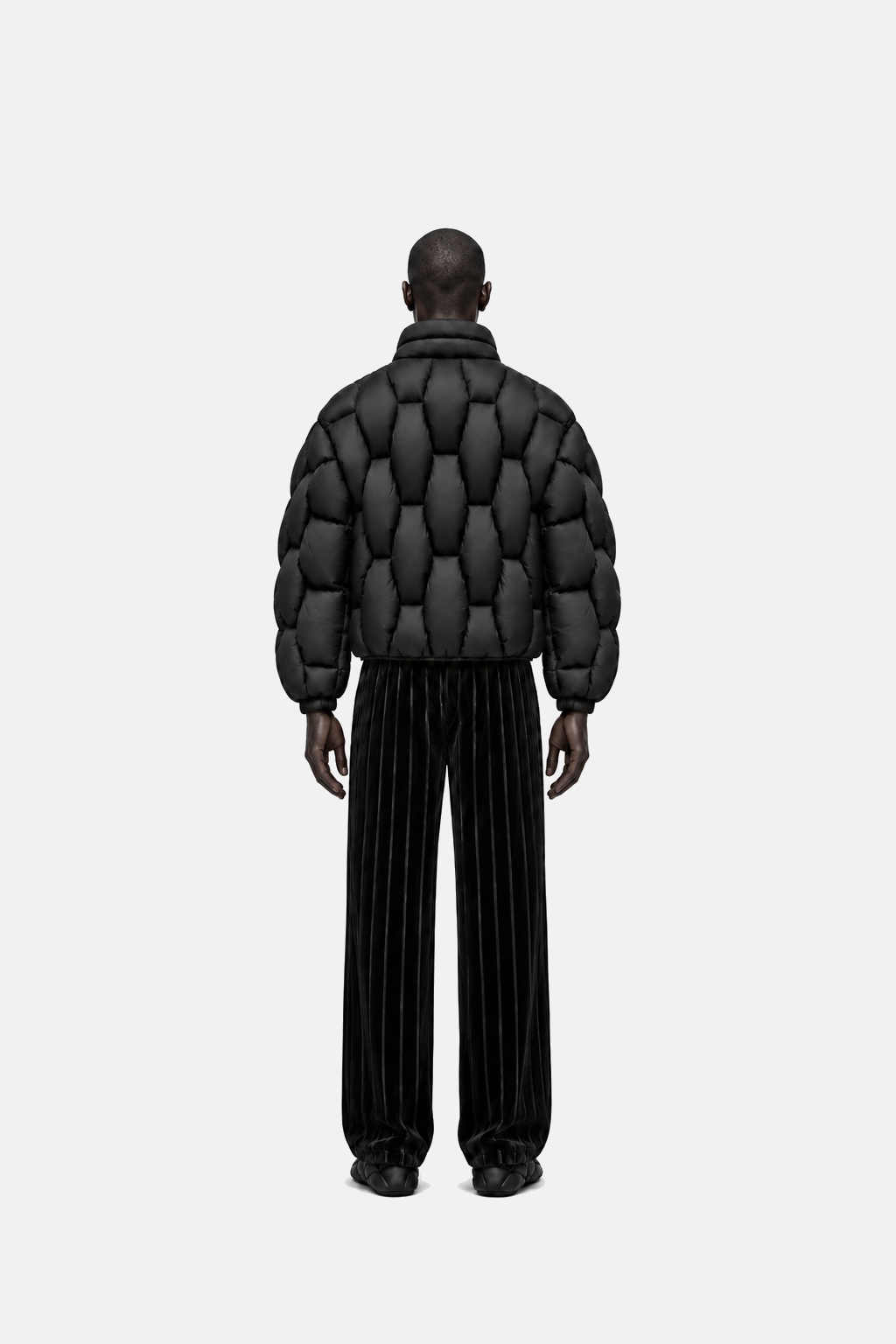 Male model wearing the black OCTAGON Pentagon matte puffer, rear view